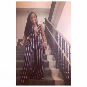 One piece jump-suit with a plunging neckline